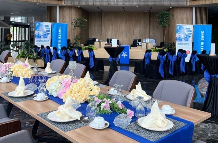 AffinMax Mobile Apps Launching — branded dining setup with blue chair bows and floral centrepieces